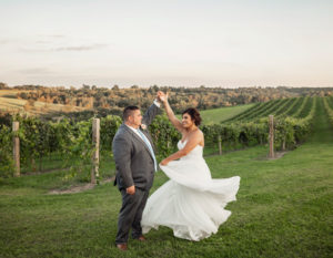 Groom and bride dancing in the vineyard at Pedretti's Party Barn in Viroqua, Wisconsin