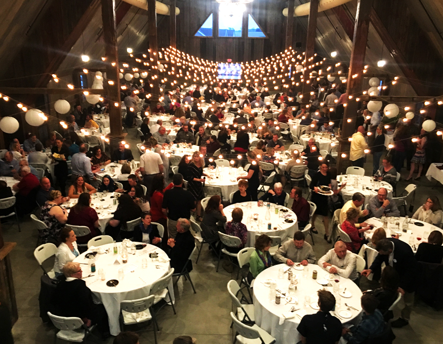 Elegant and rustic non-profit fundraiser dinner inside the barn at Pedretti's Party Barn in Viroqua, Wisconsin