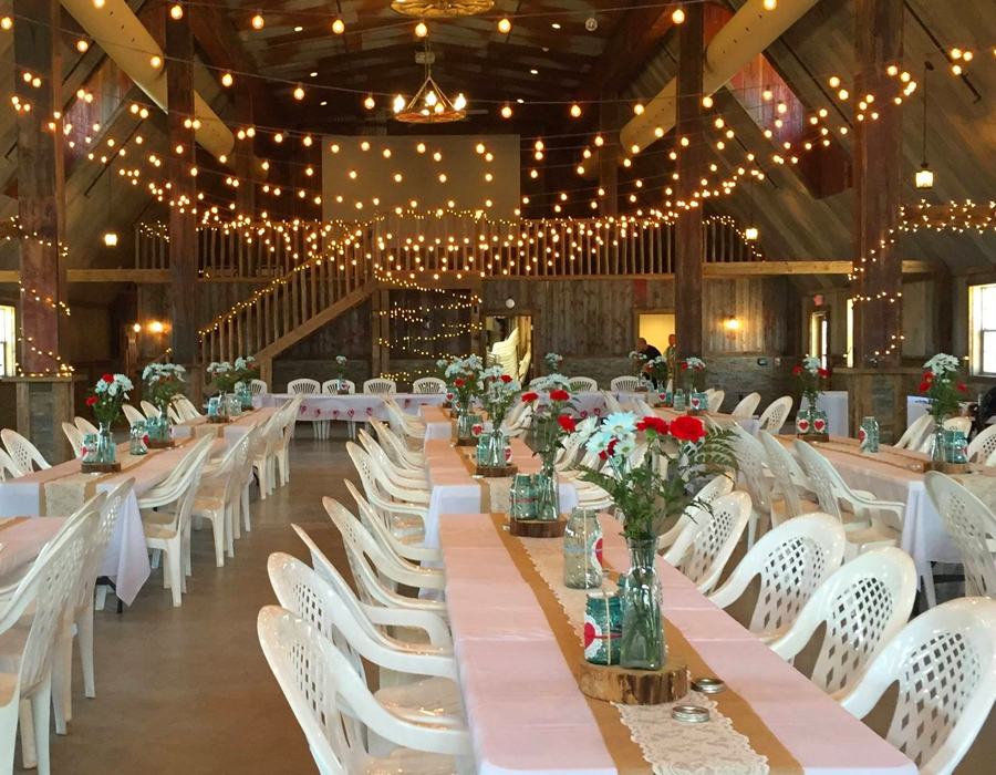 Rustic May wedding reception in the barn at Pedretti's Party Barn in Viroqua, Wisconsin